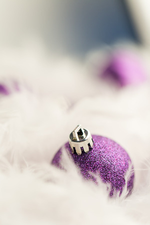 Purple Christmas Baubles in white featherの写真素材