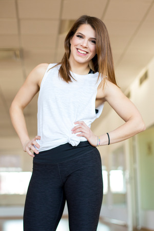 Happy fit young woman at the gymの写真素材