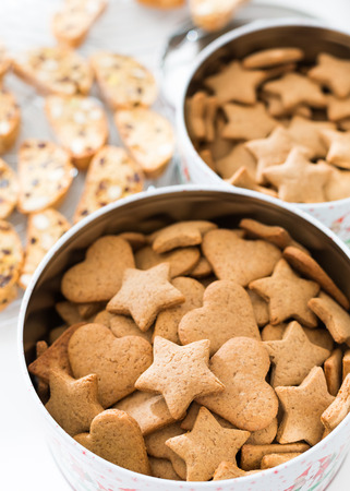 Homemade gingerbread cookies in tin canの写真素材
