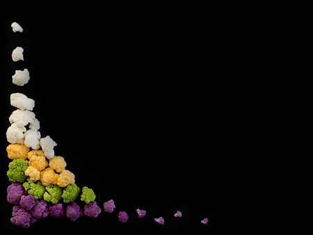 Caulifower of different colours on black backgroundの写真素材