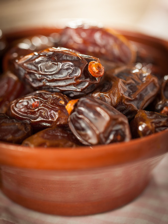 Extra sweet medjool dates in rustical bowlの写真素材