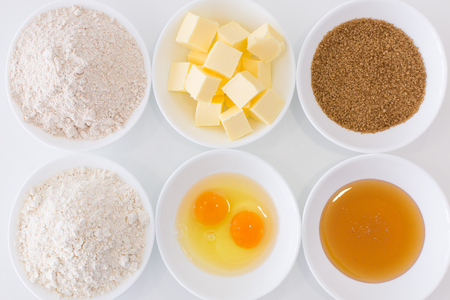 Ingredients in white cups for home made cookiesの写真素材