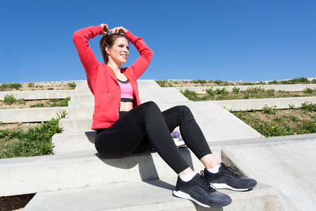 Beautiful young fit brunette woman in the cityの写真素材