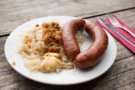 Sausage and cabbage with pork graves servedの写真素材