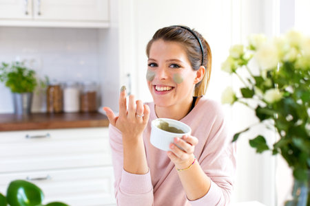 Confident young woman in her home kitchen