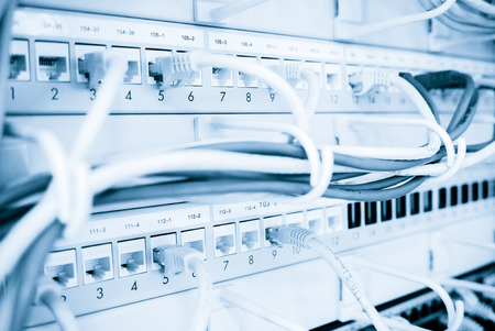 Internet cabels in patch panel and empty holesの写真素材