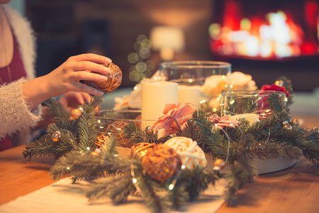 Bearded man decorating christmas table with bubblesの写真素材