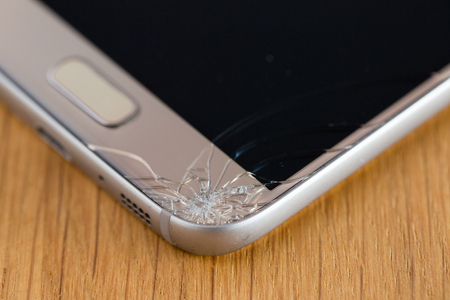 Close up of broken smart phones glassの写真素材