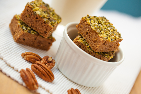 Healthy pumpkin brownies with pecan and almond milkの写真素材