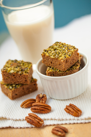 Healthy pumpkin brownies with pecan and almond milkの写真素材