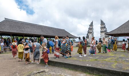 Lempuyang, Bali / Indonesia - August 16th 2018: Overcrowded balinese Lempuyang temple gates. Tourists are waiting in line for 2 hours to take a photo.のeditorial素材