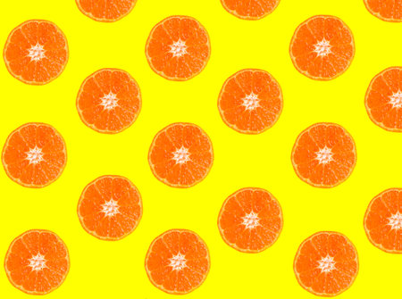 Tangerine slices isolated on yellow background
