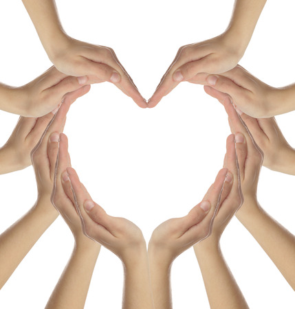 Female hands making a heart shape isolated on whiteの写真素材