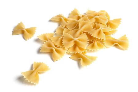 Heap of farfalle pasta isolated over white backgroundの写真素材