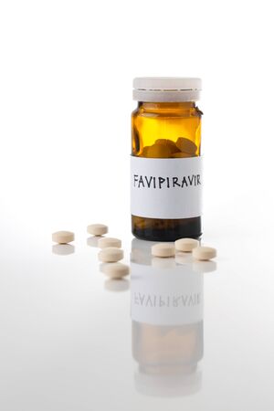 Favipiravir experimental drug for treating covid 19 on white background with copy spaceの写真素材