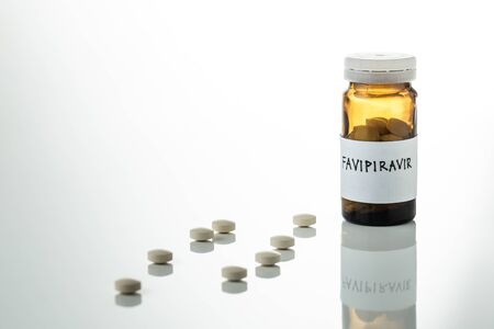 Favipiravir experimental drug for treating covid 19 on white background with copy spaceの写真素材
