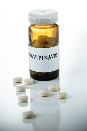 Favipiravir experimental drug for treating covid 19 on white background with copy spaceの写真素材