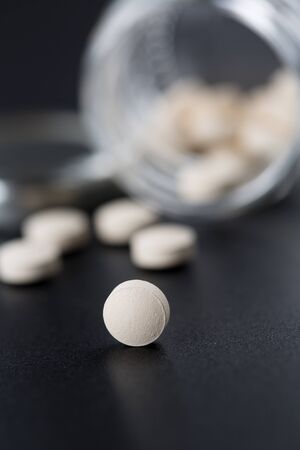 Favipiravir experimental drug for treating covid 19 on dramatic dark background with copy spaceの写真素材