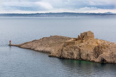 Old ruins of fortress Fortica near Pag bridge in Croatian Dalmatia Coastの写真素材