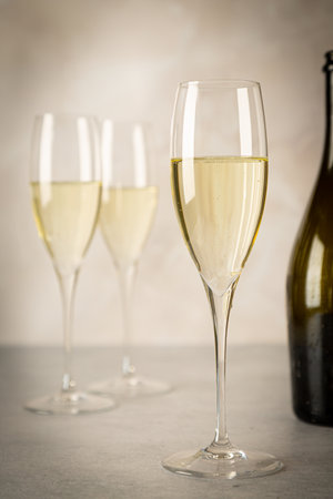 Festive photo of sparkling wine in glassesの写真素材