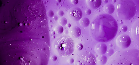 beautiful background of paint bubbles floating on water with mix of oil colors