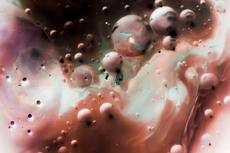 beautiful background of paint bubbles floating on water with mix of oil colors