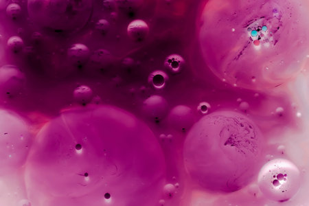 beautiful background of paint bubbles floating on water with mix of oil colors