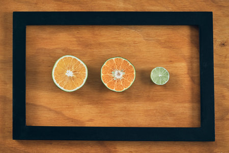 Citrus fruits cut on a wooden table