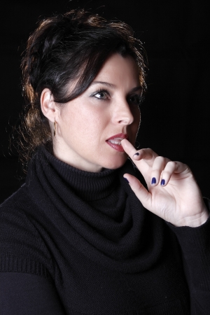 young brunette woman outdoors posing for the camera aloneの写真素材