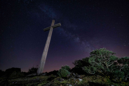 Milky way in a summer night with a Christian cross in a Franqueira, in a summer night. Galicia, Spainの写真素材