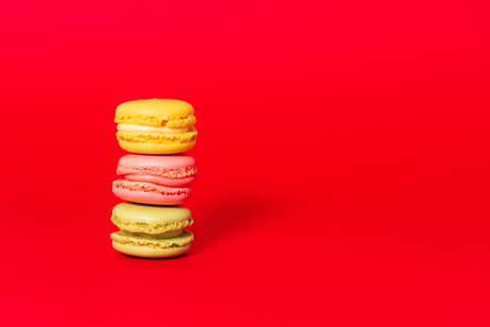 Macarons on red backgroundの写真素材