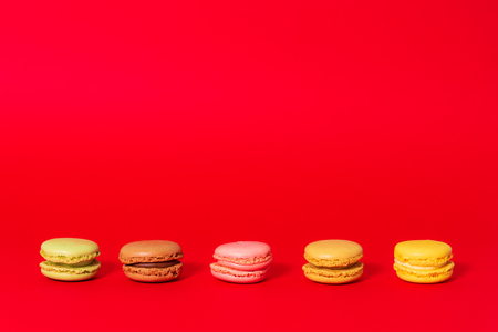Macarons on red backgroundの写真素材