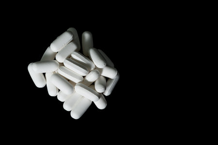 Pills on plain background