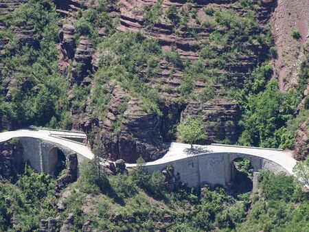 The Gorges de Daluis in the French Provence is known not only for the red rocks. It simply lacks the space for the road and so change tunnels and bridges constantly.の写真素材