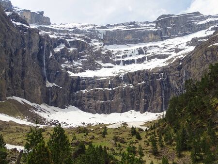 The 'Cirque de Gavarnie' is a tourist magnet of the French Pyrenees. 1500m high vertical rock walls and over 400m high waterfalls provide for it.の写真素材