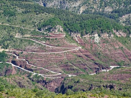 The Gorges de Daluis in the French Provence is known not only for the red rocks. It simply lacks the space for the road and so change tunnels and bridges constantly.の写真素材