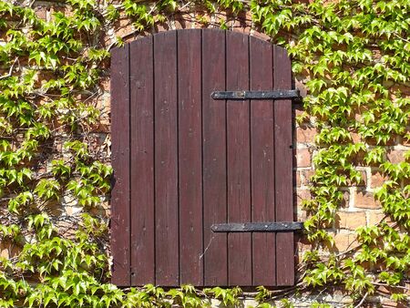 Old fashioned door of an shanty, known from Grandmas house, where we played, when we was children.の写真素材