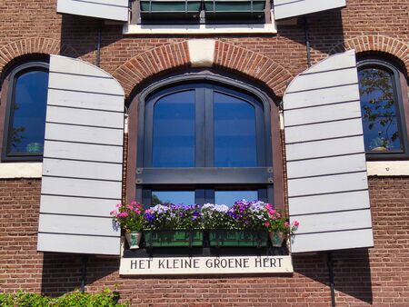 Window of a residential house on a canal in Amsterdam.の写真素材