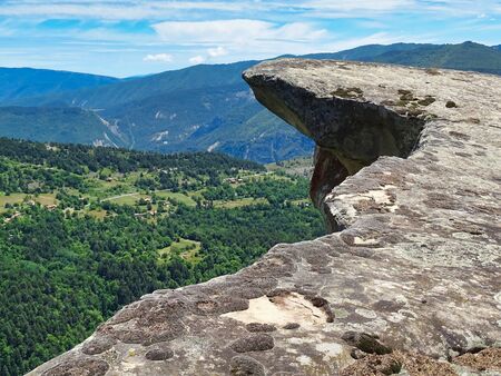 This rocky plaque near Annot in Provence is located in a beautiful sandstone landscape, which is very interesting for hikers.の写真素材