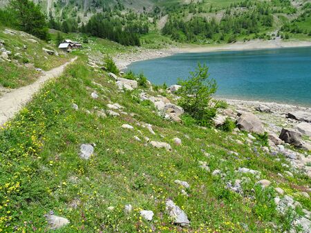 The Lac d'Allos is a beautiful mountain lake in the French Alps at Allos in Provence. You can drive up to an hour pleasant hike to the lake by car.の写真素材