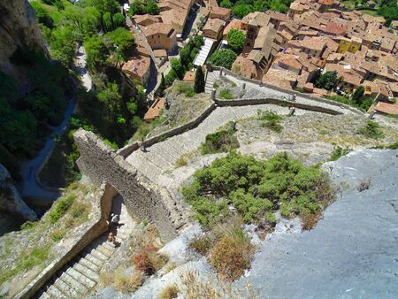 View from Chapelle Notre-Dame de Beauvoir down to the Moustiers-Sainte-Marie village in the French Provence.の写真素材