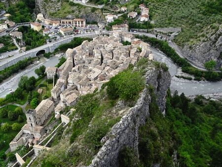 The place Entrevaux is located in the Alps of the French Provence. He is fondly visited for his great old town with the narrow streets, the citadel on the mountain and the famous path there.の写真素材