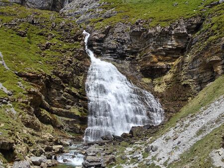 At the end of the popular Ordesa Valley in the Spanish Pyrenees, the horsetail waterfall 'Cola de Caballo' is the most popular destination.の写真素材