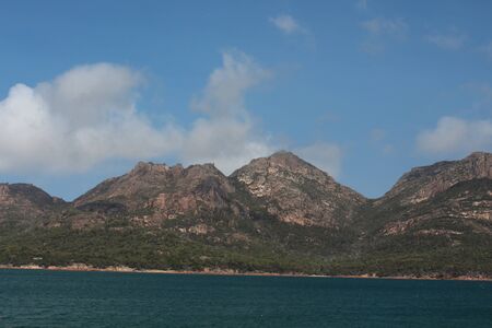 Tasmania coastal landscape Freycinet National Park with Mount Amos, Mount Dove, Mount Maysonの写真素材