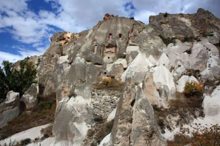 Cliff dwelling in tuff stone formation in Cappadocia, Turkeyの写真素材