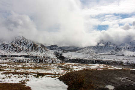 Snow capped mountains in autumn in Denali National Park, Alaskaの写真素材