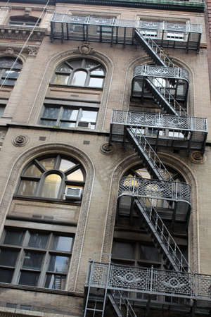 Typical old houses with fire escape in New York in United Statesの写真素材