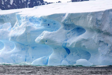 Iceberg in Marguerite Bay, Antarctica. Marguerite Bay is a long bay on the southwest coast of the Antarctic Peninsula.の写真素材