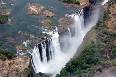 The Victoria Falls are a wide waterfall of the Zambezi Zimbabwe and Zambia. The waterfalls photographed from a helicopter.の写真素材
