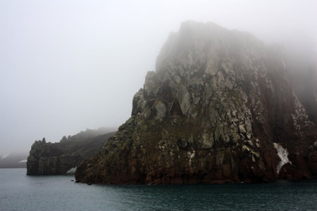 Neptune's Bellows Deception Island in fog, Antarctica. Neptunes Bellows is a strait and the entrance to Deception Island.の写真素材